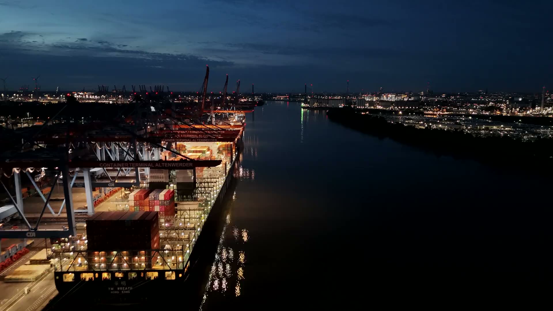 Container port and river at dusk